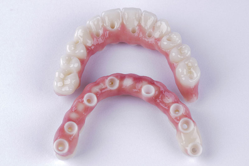 two full arch models of zirconia fixed bridges.